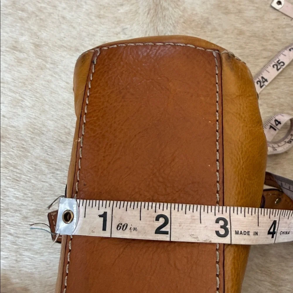 This is a vintage Michael Kors brown leather shoulder bag featuring gold studs